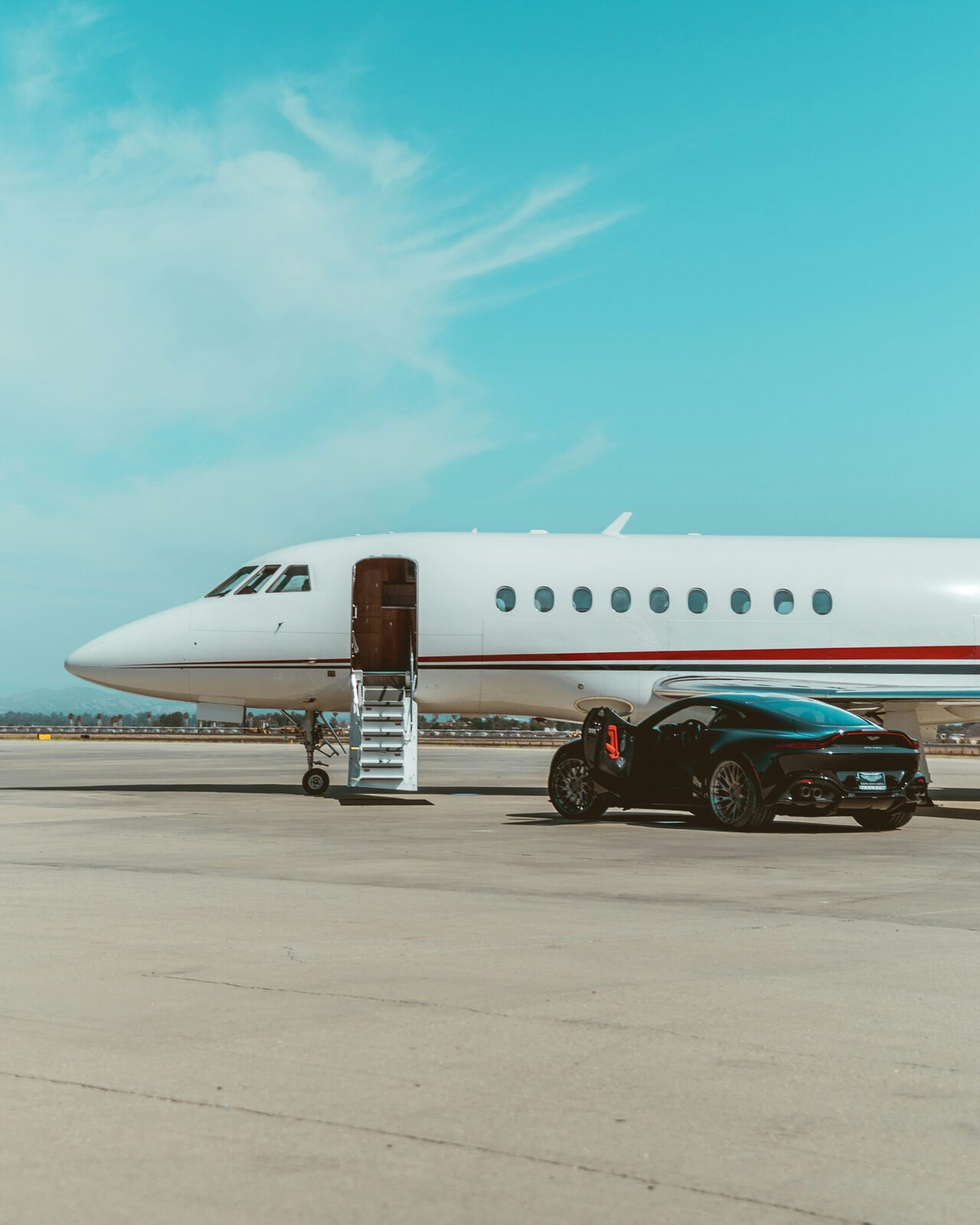 Private jet and vehicle on tarmac