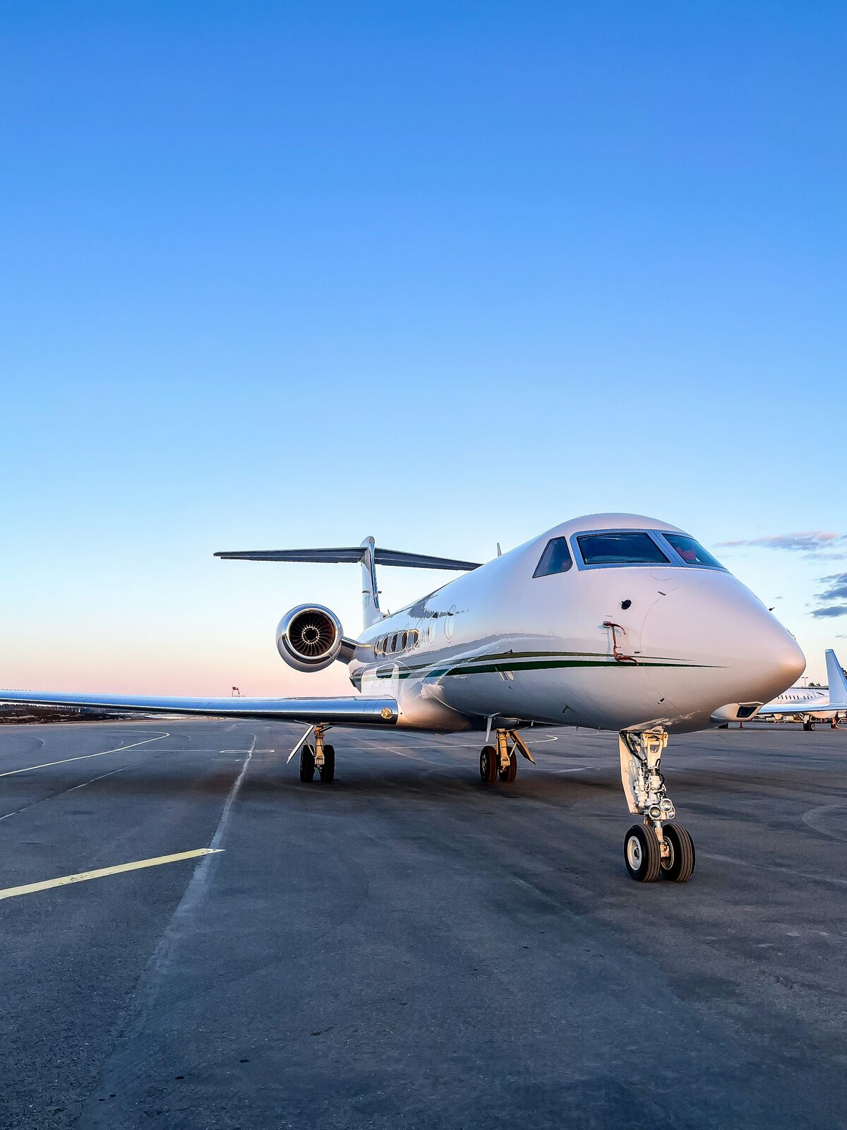 Private jet on the tarmac at dusk